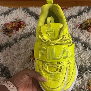 Neon yellow disruptor Fila tennis shoes